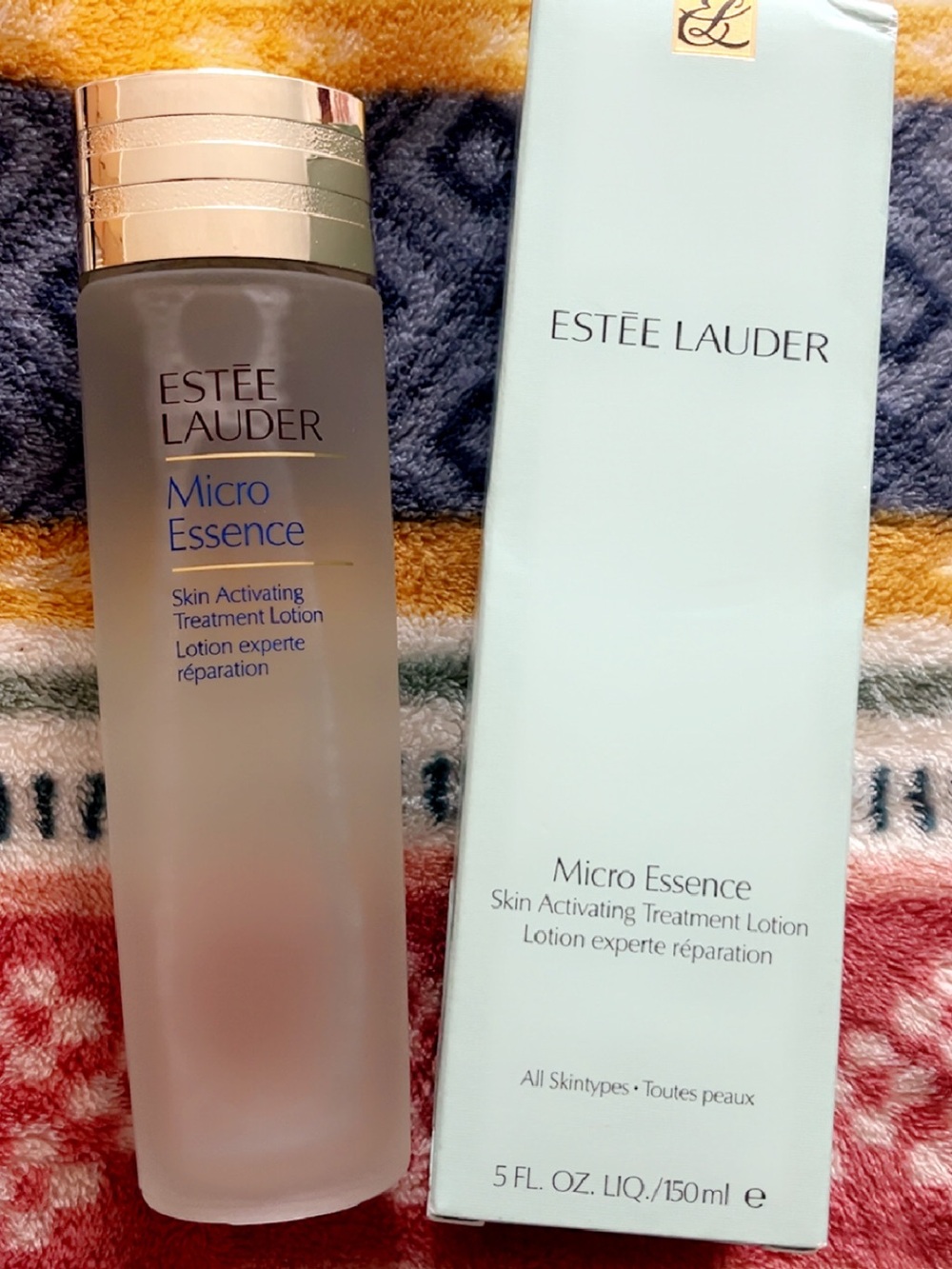 Estee Lauder Micro Essence Toner — Frosted Glass with Gold Cap